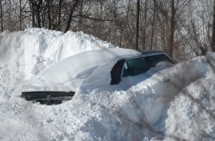 car buried in snow