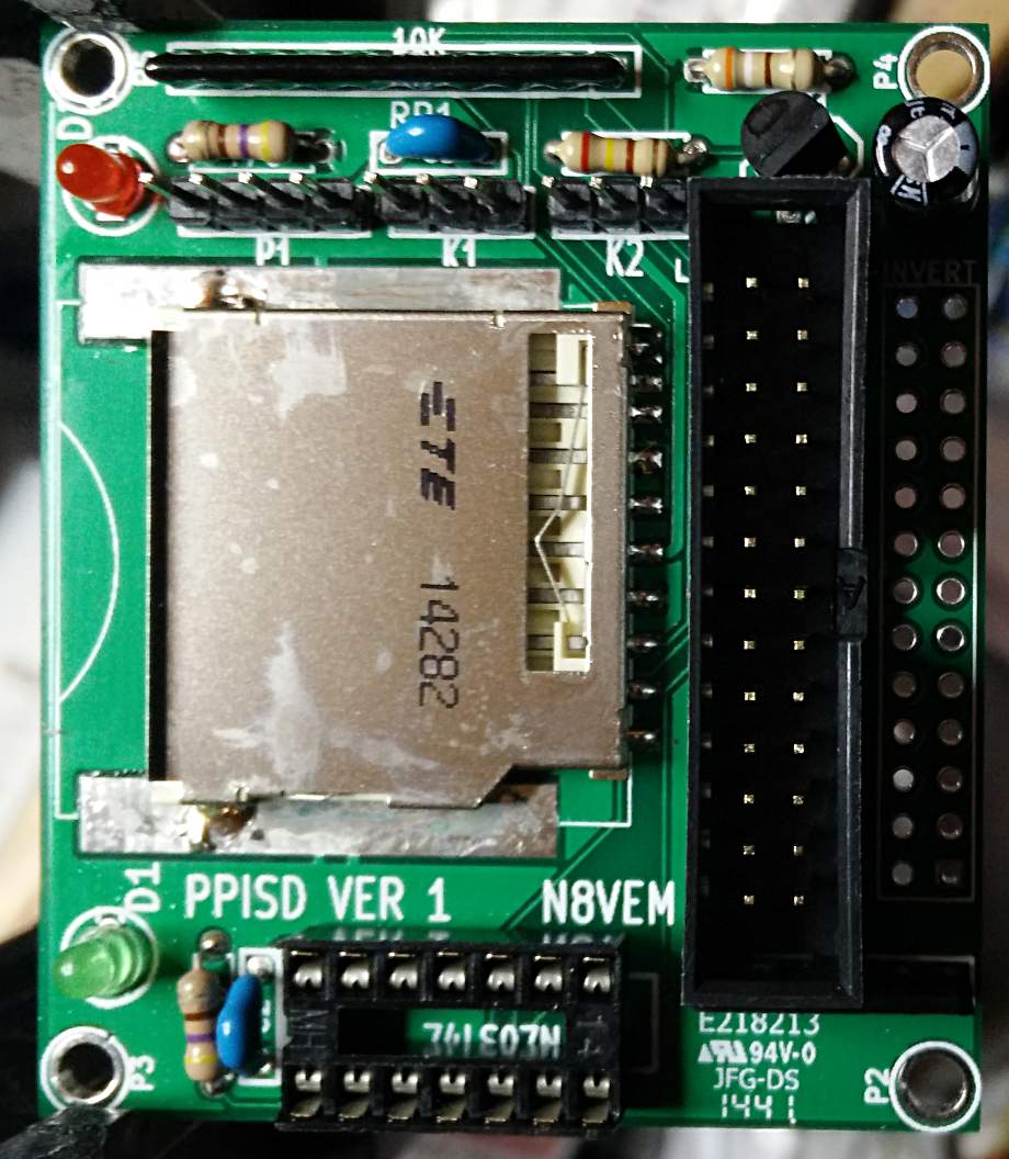 green circuit board with secure digital card slot on left and 40-pin parallel interface connectors on the right