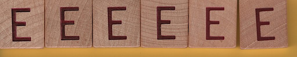 six wooden letter E tiles from SCRABBLE® Anagrams